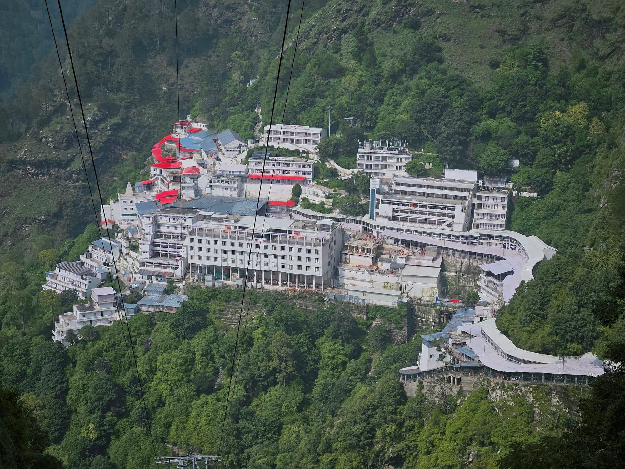 The Vaishno Devi Bhawan shrine complex on a forested mountainside above Katra
